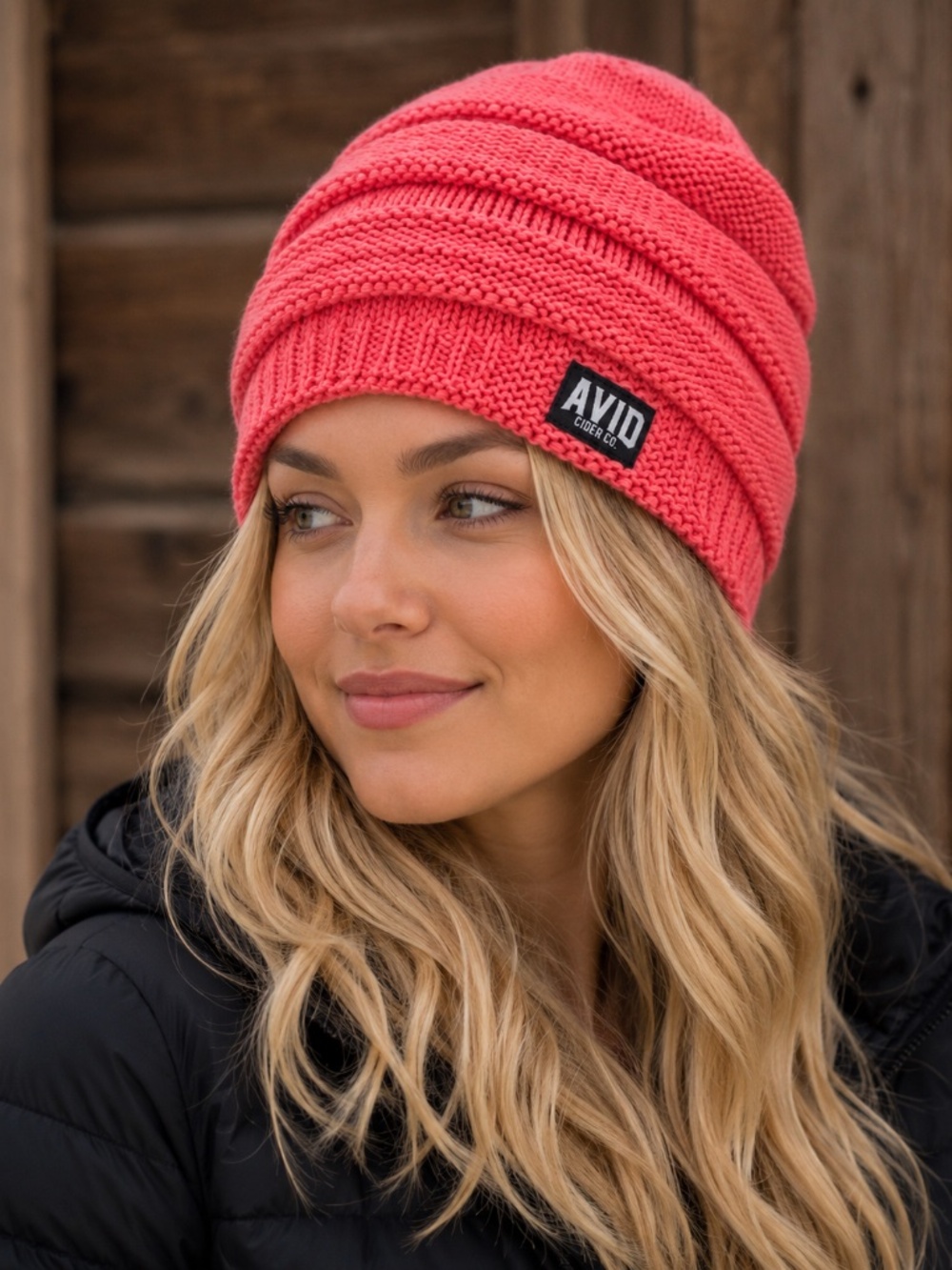 Coral-Colored slouch-style knit beanie from AVID CIDER CO. in Bend, Oregon